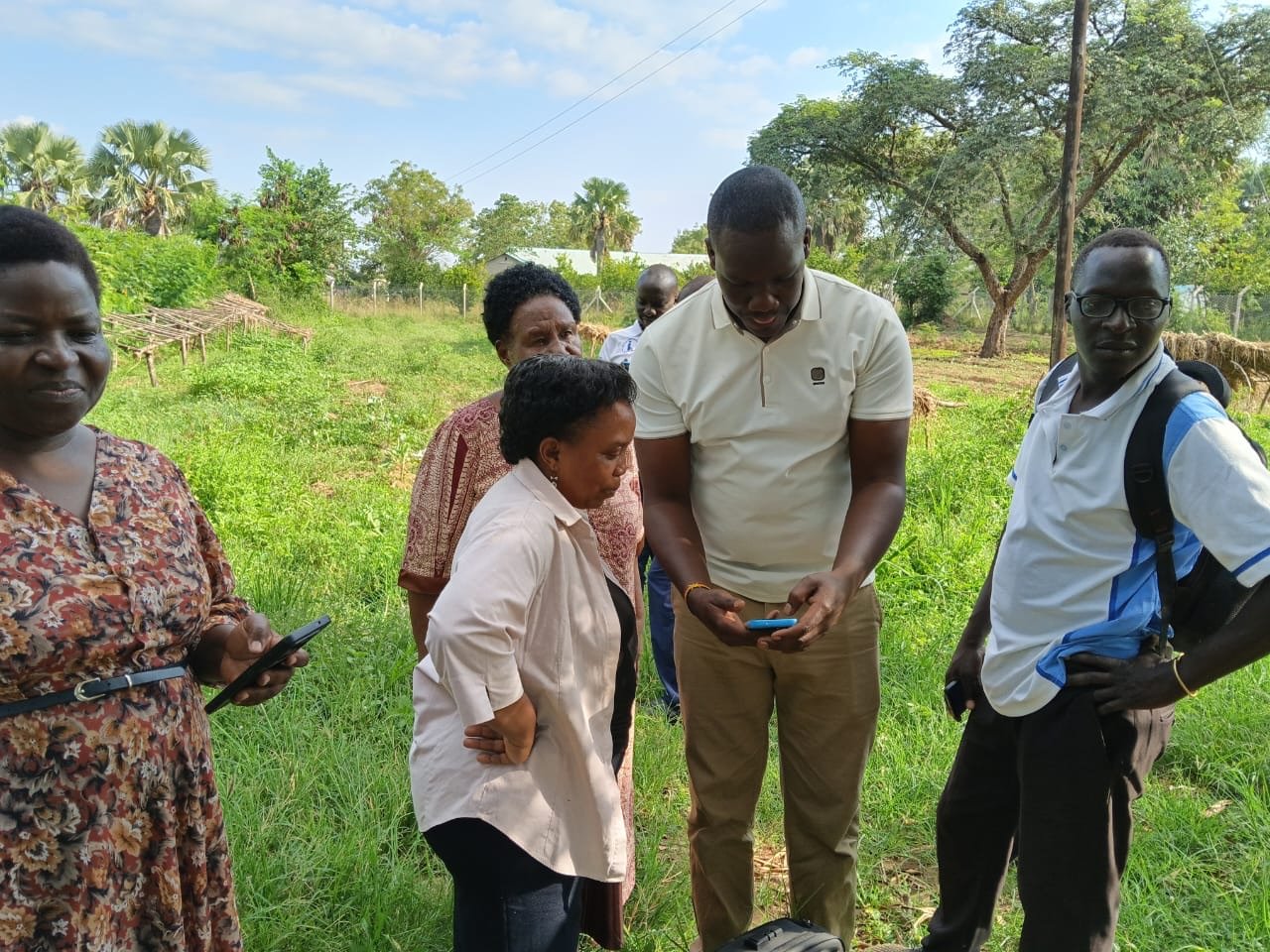Participants examine information on a mobile device in the field