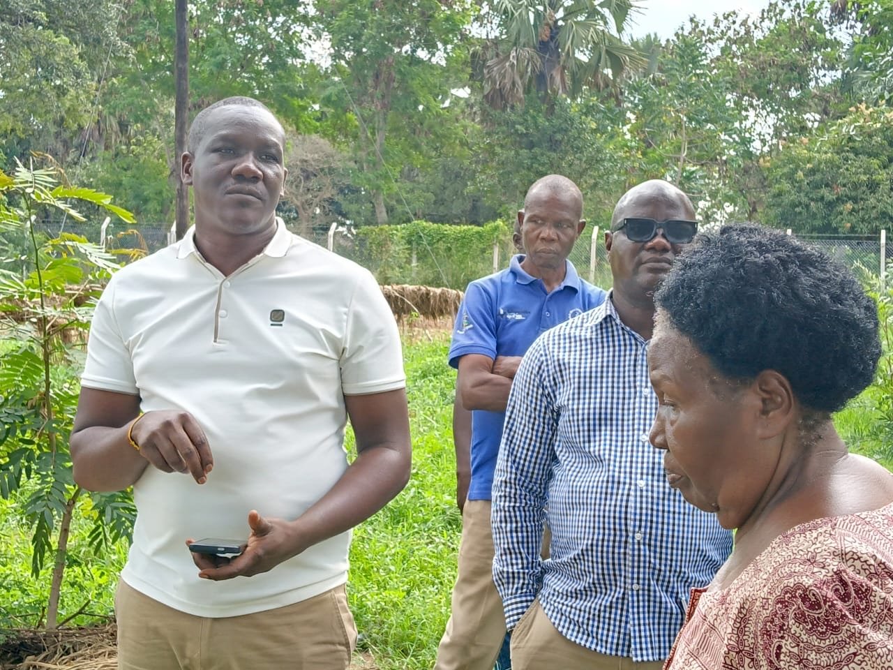 Partners listen during an on-site explanation at Aminit