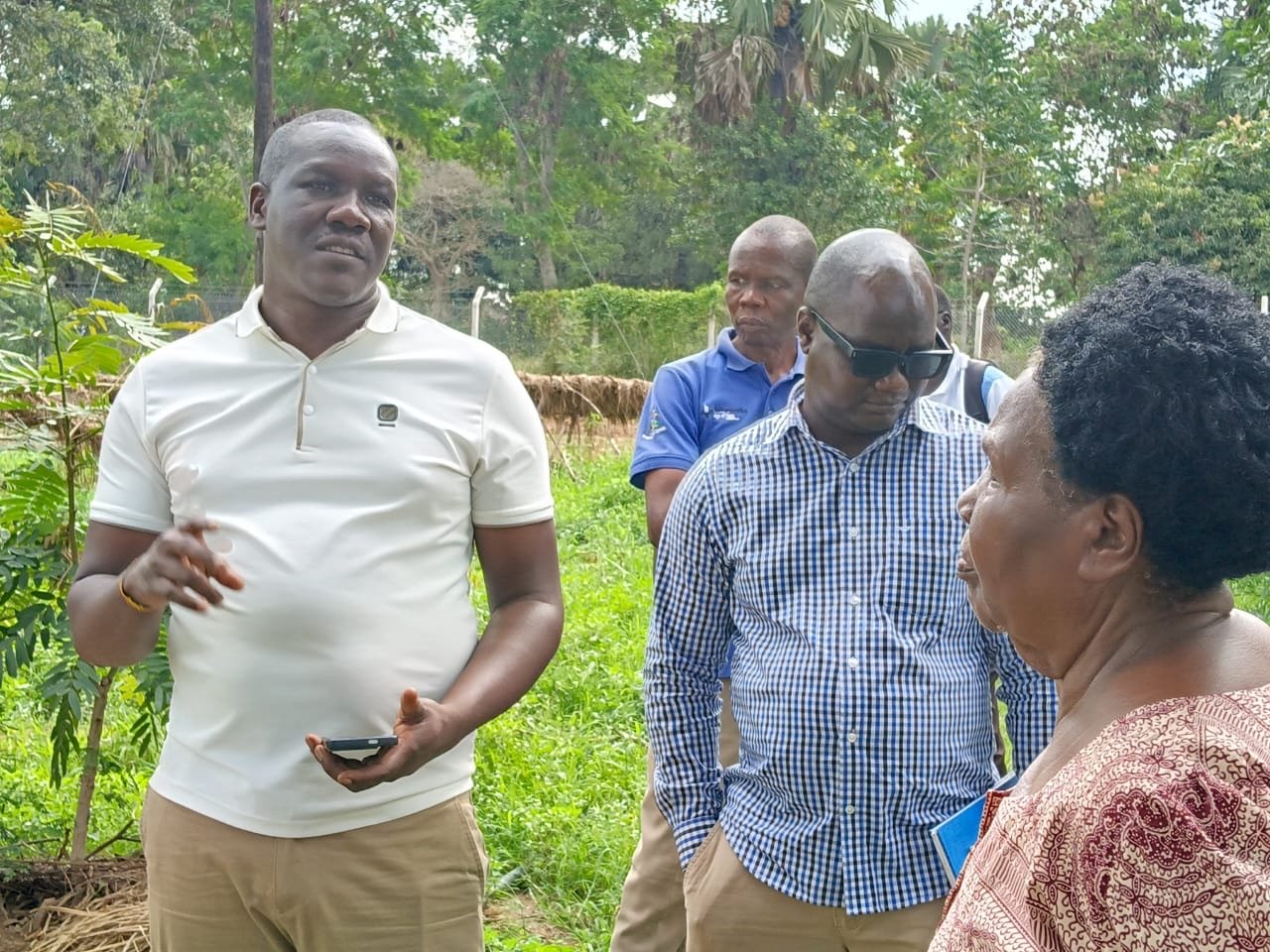 A presenter briefs partners during the Aminit field visit