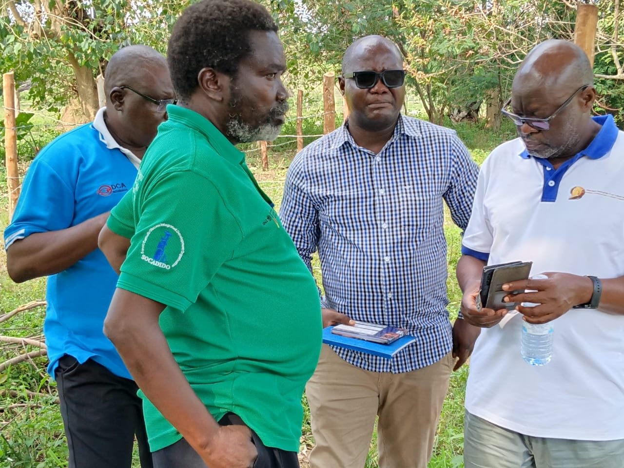 Project partners review information during the practical field session